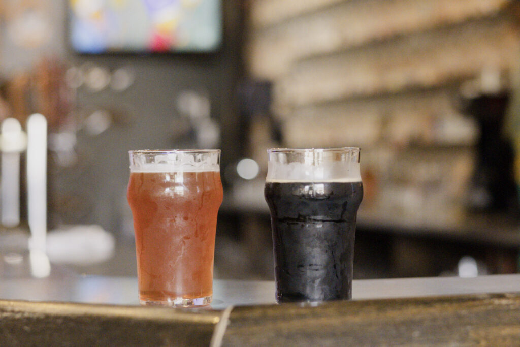 Image of an IPA and a Stout at Our Brewing Company in Holland, MI!